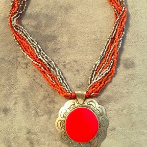 Beaded necklace with large pendant